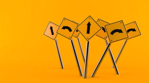 Street signs with arrows pointing in different directions